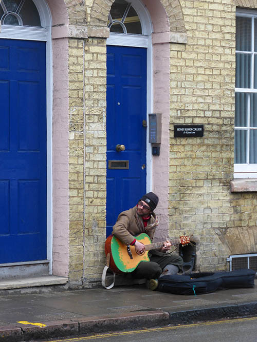 Busker Dylan Skelton warms up outside The Hidden Rooms before his audition