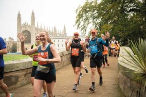 A group of runners with King's College in the background