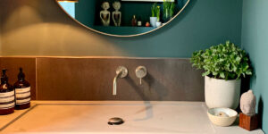 Warm-toned task lighting in the bathroom adds to the layering effect