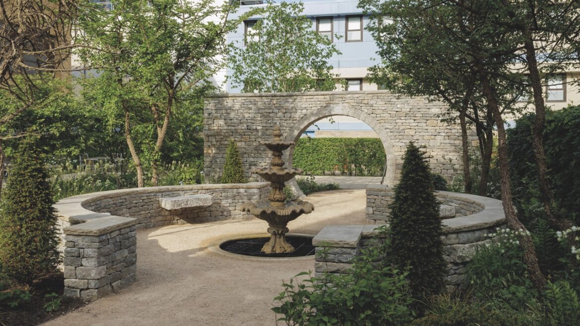 A circular seating area in a garden outside a medical building
