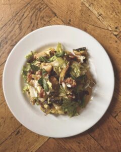Top view of a savoury dish with lettuce and cauliflower