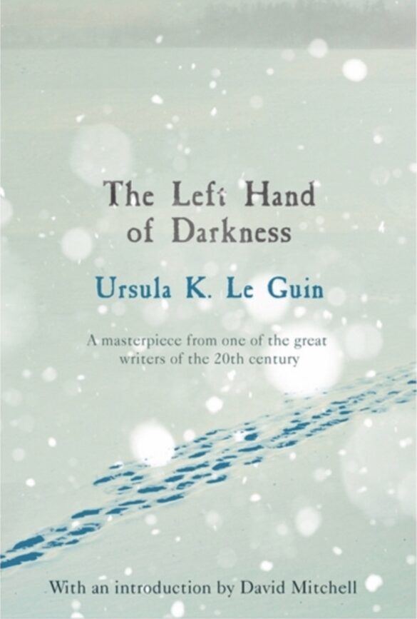 a book cover showing a snowy environment with footprints in the snow. The book is titled The Left Hand of Darkness