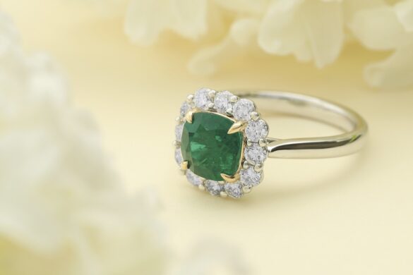 Magazine Image Large A silver ring with a green gem by Cellini in the middle of yellow flowers