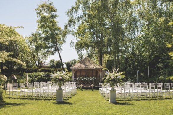 highres__11__sarah-liam__cat-lane-weddings Large A wedding venue set up outside on green grass at South Farm