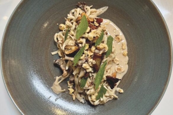 Top view of a mushroom dish on a grey plate