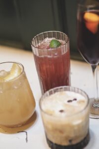 Three drinks containing juices and smoothies