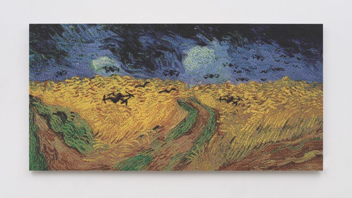 A landscape painting of a field and sky. The painting is hung on an off-white wall
