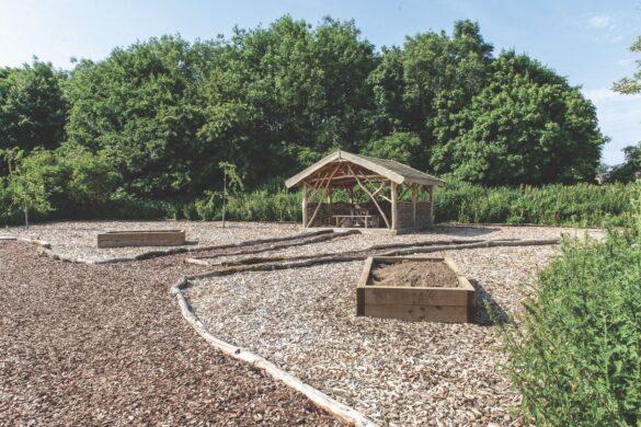 Teachers at Gretton (above) and Kimbolton (right) say that managing support and inclusion properly benefits everyone, not only children with learning difficulties An empty garden area with walkways and wooden structures