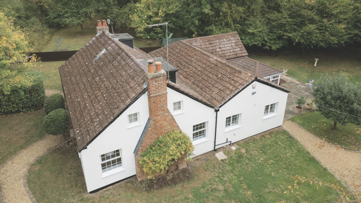 Top view of a large white house in the countryside