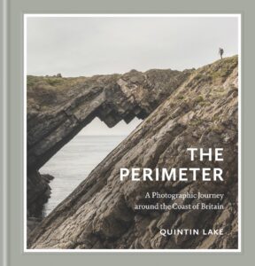 The front cover of a book titled The Perimeter with a rocky coastal landscape on the front