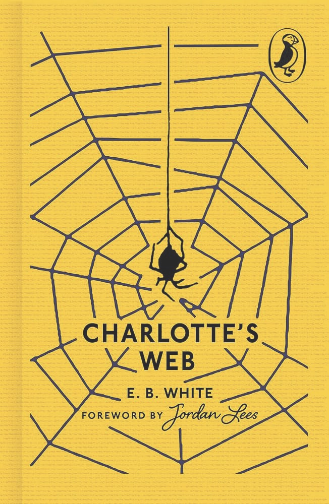 Puffin Books’ Clothbound Collection by various authors The yellow front cover of a book titled Puffin Books' Clothbound Collection with a spider and web on the front