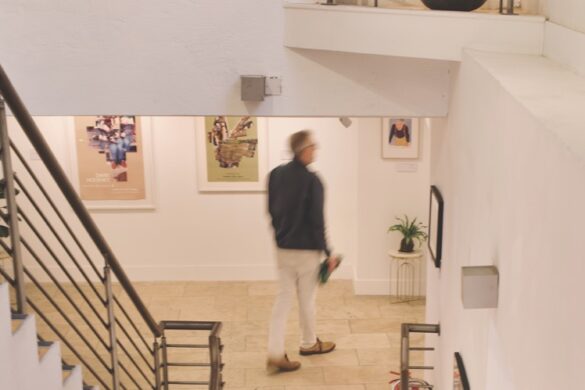 The interior of a gallery called Modo with a person walking near stairs
